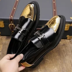 Men's Black and Gold Slip-On Loafers with Decorative Buckle and Brogue Detailing – Stylish Formal Shoes for Office and Special Occasions