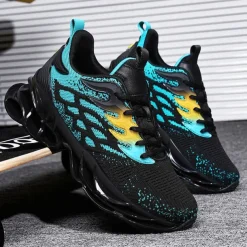 Men's Blue Athletic Sneakers with Unique Hollow Sole Design, Breathable Knit Upper, and Flame Detail – Lightweight Running Shoes with Orange Accents