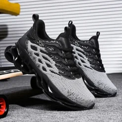 Men's Blue Athletic Sneakers with Unique Hollow Sole Design, Breathable Knit Upper, and Flame Detail – Lightweight Running Shoes with Orange Accents