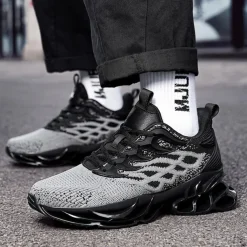 Men's Blue Athletic Sneakers with Unique Hollow Sole Design, Breathable Knit Upper, and Flame Detail – Lightweight Running Shoes with Orange Accents