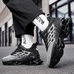 Men's Blue Athletic Sneakers with Unique Hollow Sole Design, Breathable Knit Upper, and Flame Detail – Lightweight Running Shoes with Orange Accents