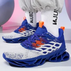Men's Blue Athletic Sneakers with Unique Hollow Sole Design, Breathable Knit Upper, and Flame Detail – Lightweight Running Shoes with Orange Accents