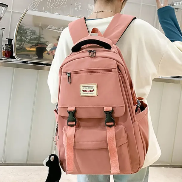 Pink Waterproof School Bags Nylon Backpack with Plush Monkey Keychain - Stylish and Durable School Bag with Multiple Pockets for Travel and Everyday Use