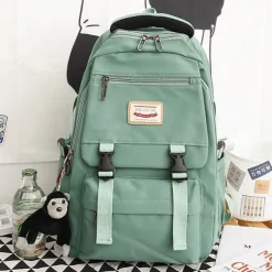 Pink Waterproof School Bags Nylon Backpack with Plush Monkey Keychain - Stylish and Durable School Bag with Multiple Pockets for Travel and Everyday Use