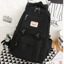 Pink Waterproof School Bags Nylon Backpack with Plush Monkey Keychain - Stylish and Durable School Bag with Multiple Pockets for Travel and Everyday Use