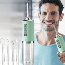 Portable Rechargeable Electric Teeth Irrigator with 4 Green Heads - Effective Oral Dental Seam Washer for Men and Women Perfect for Water Flossing and Cleaning