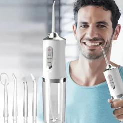 Portable Rechargeable Electric Teeth Irrigator with 4 Green Heads - Effective Oral Dental Seam Washer for Men and Women Perfect for Water Flossing and Cleaning