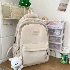 Women's Light Green School Backpack with Cute Plush Bear Keychain, Large Capacity Multi-Pocket Waterproof Bookbag for Teen Girls, College, and Daily Use